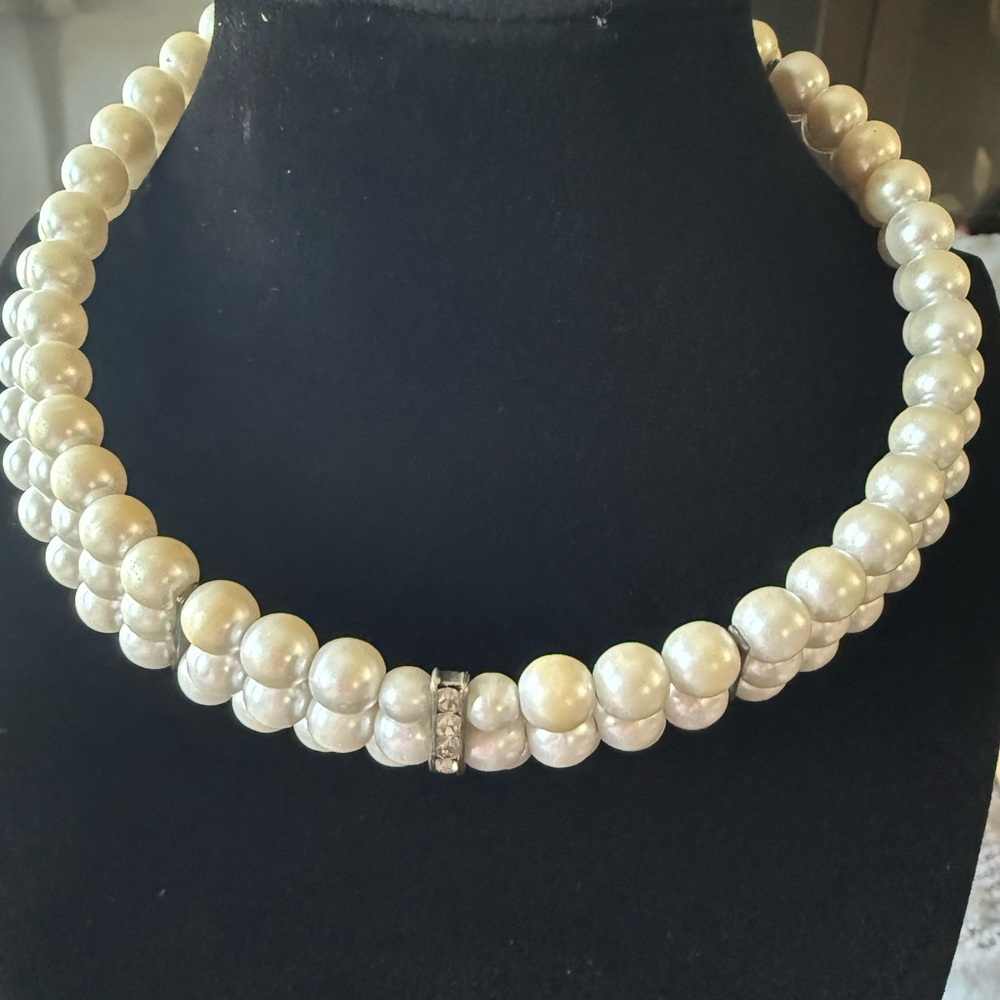 Faux (?) pearl triple-strand choker with rhinestone accents.